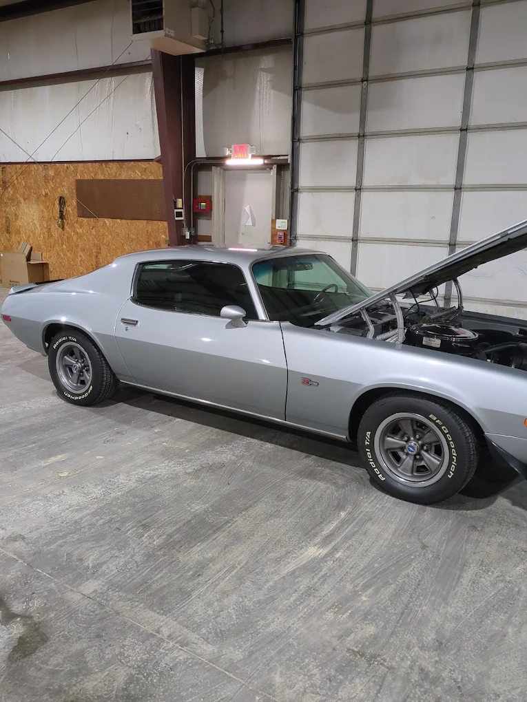 Silver second-generation Chevrolet Camaro Z28 in the shop bay